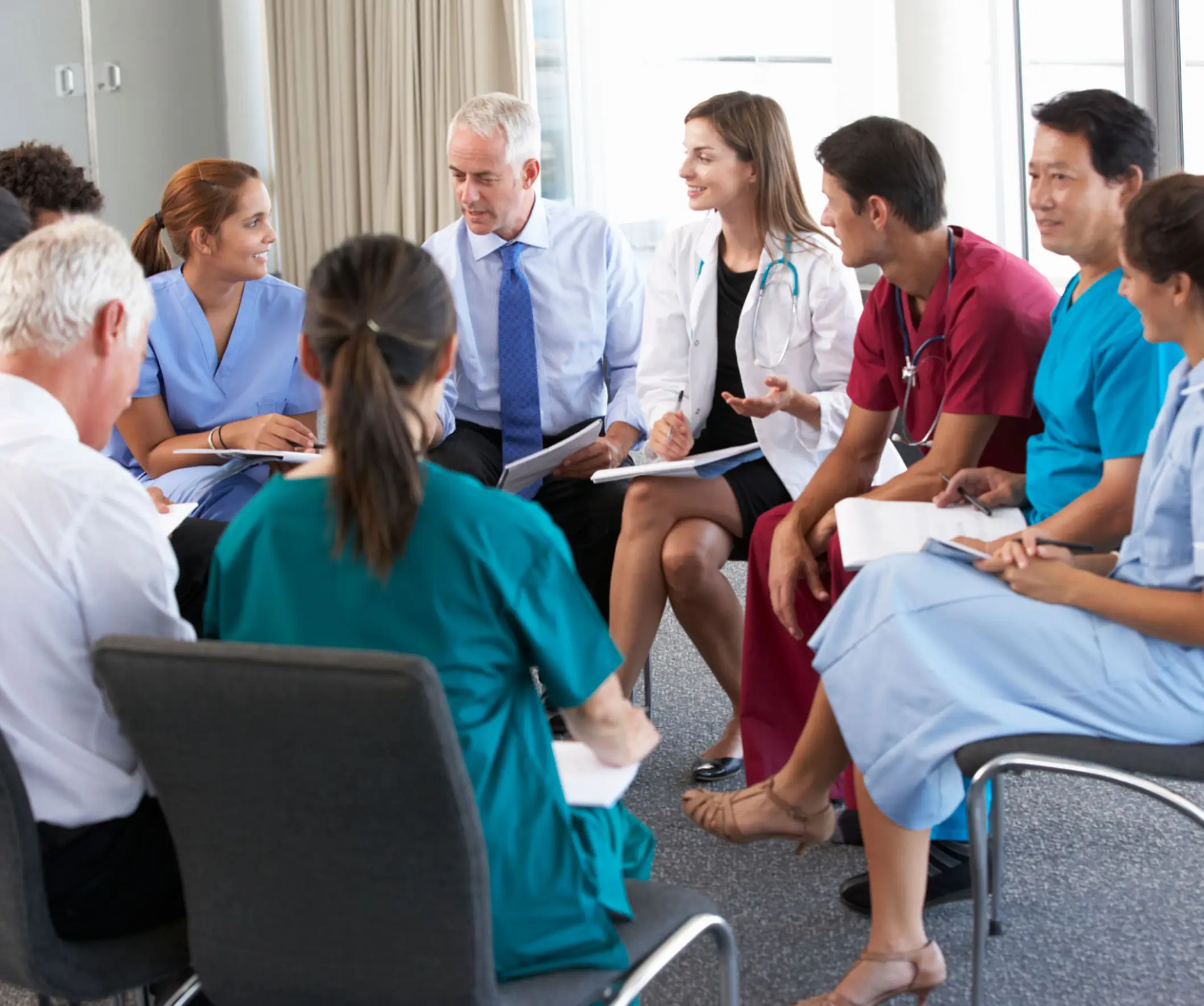 Medical team having a discussion in meeting.